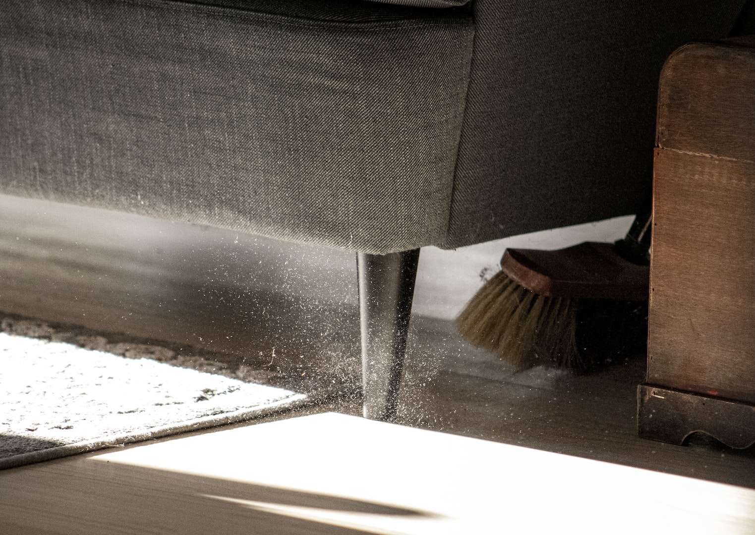 sweeping under the couch