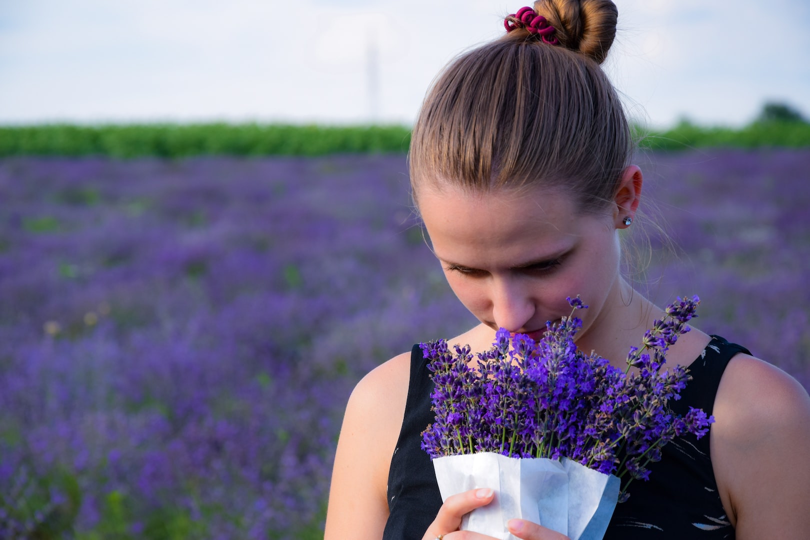 girl smelling flowers