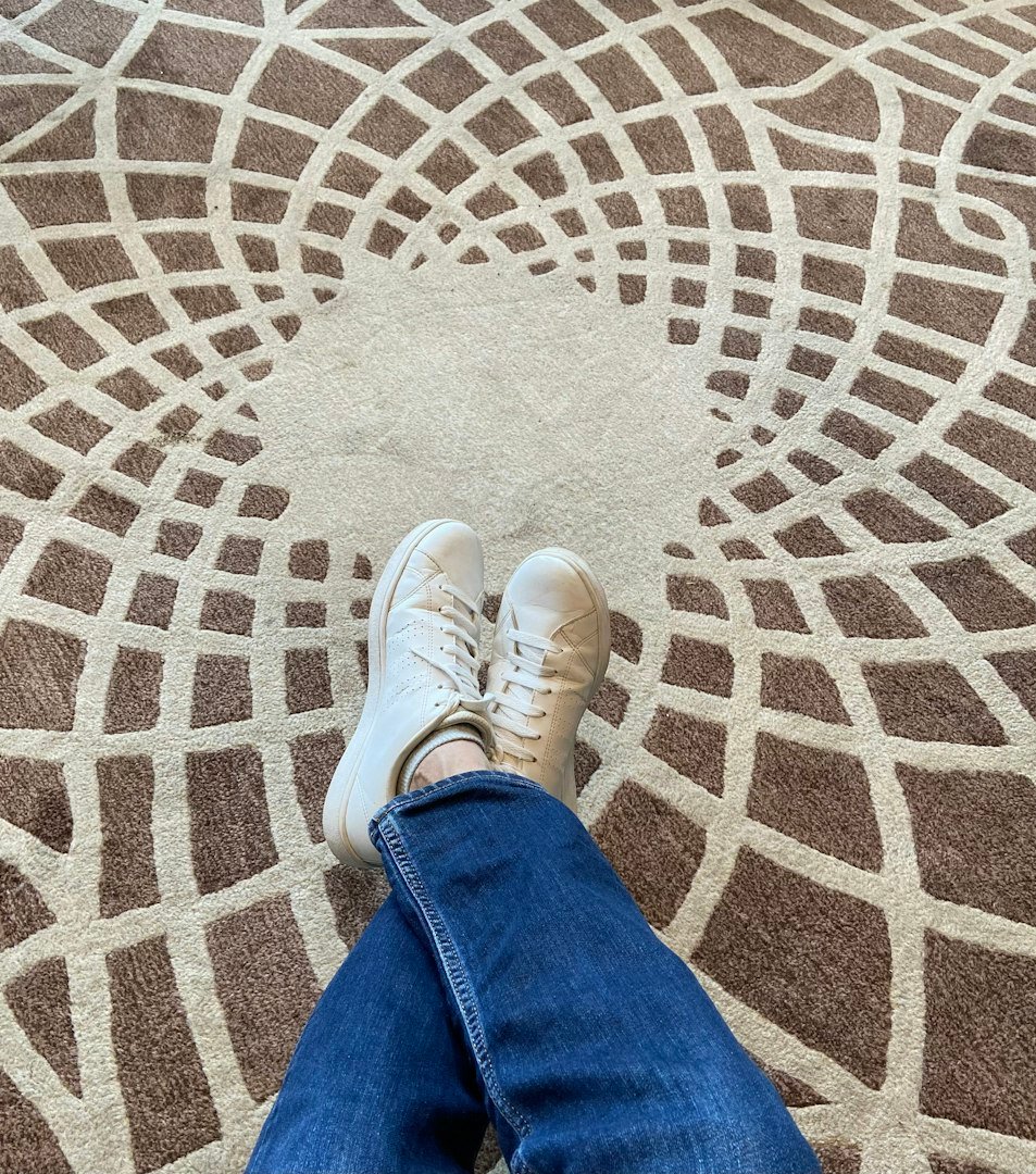 person relaxing on a rug