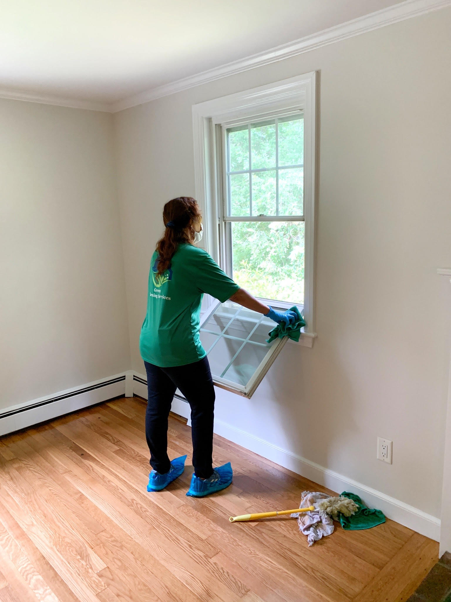 woman cleaning window