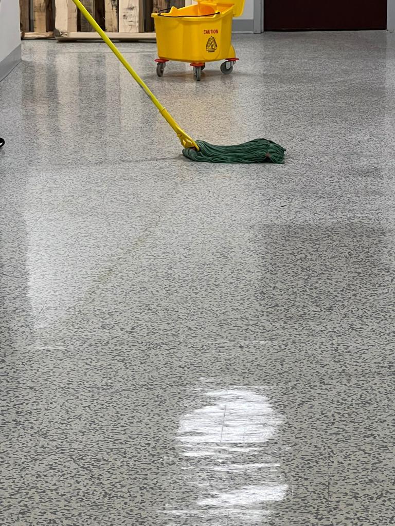 mopping a floor at a commercial facility