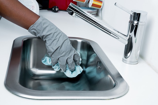 wiping down a kitchen sink