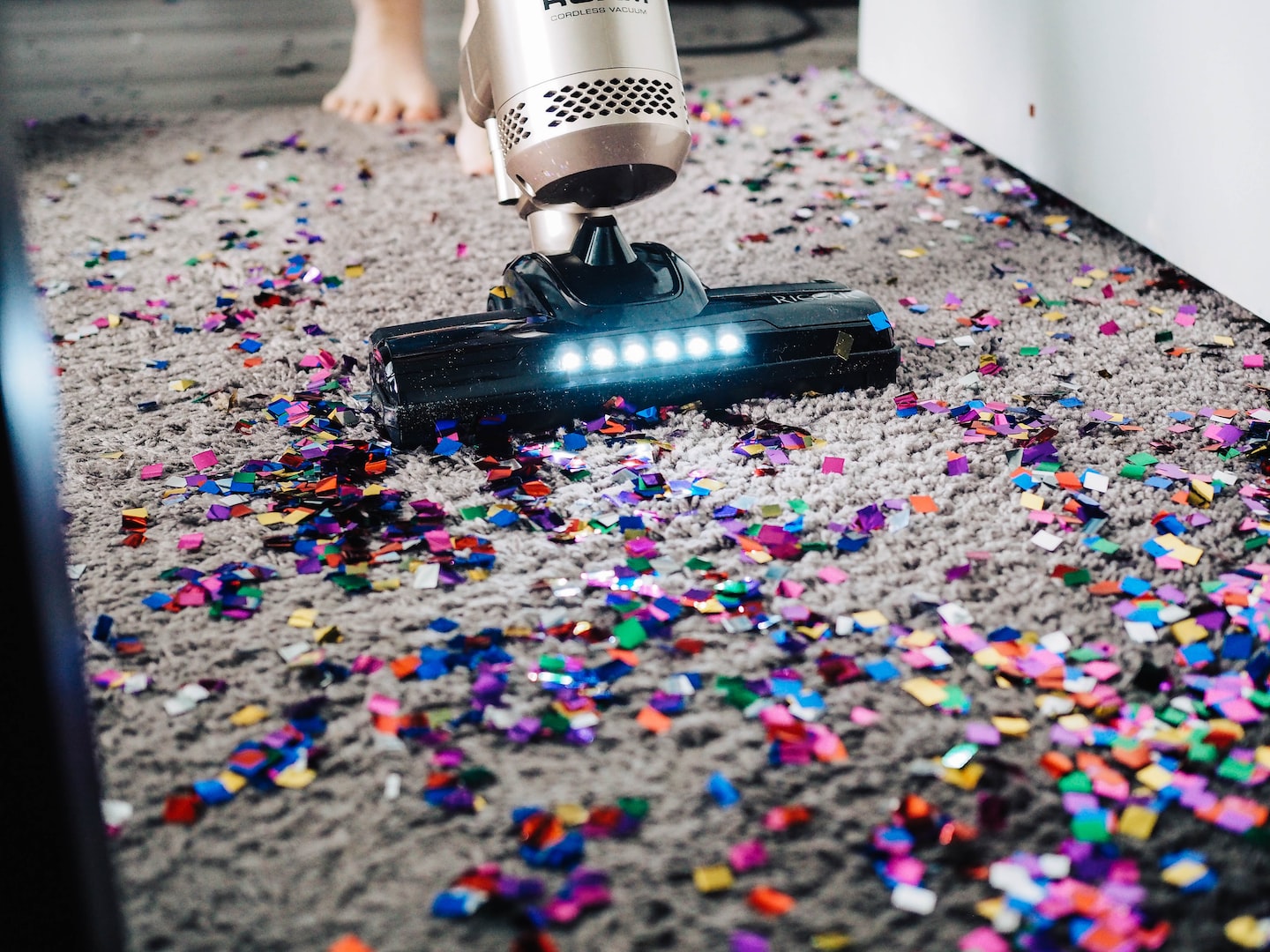 vacuuming a carpet